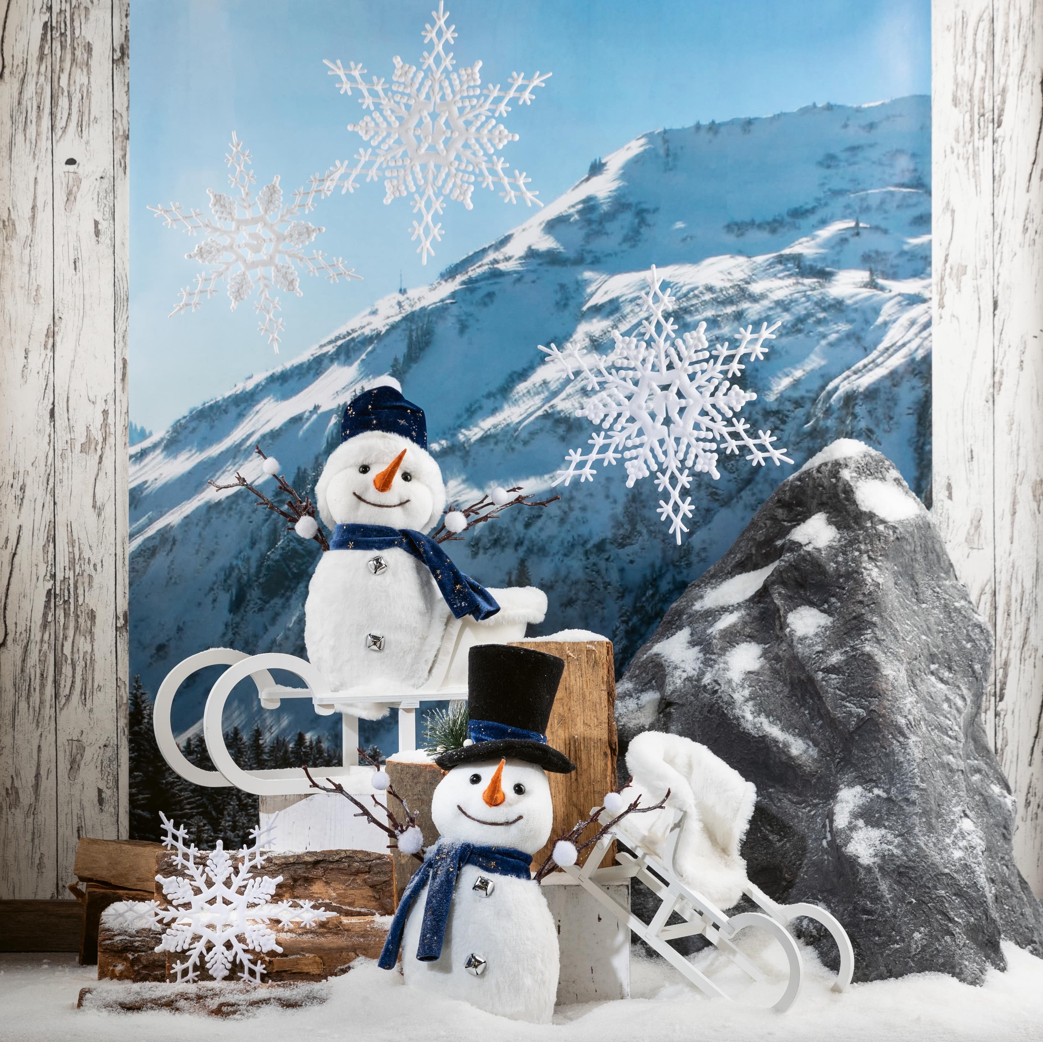 Schneemänner und Schlitten